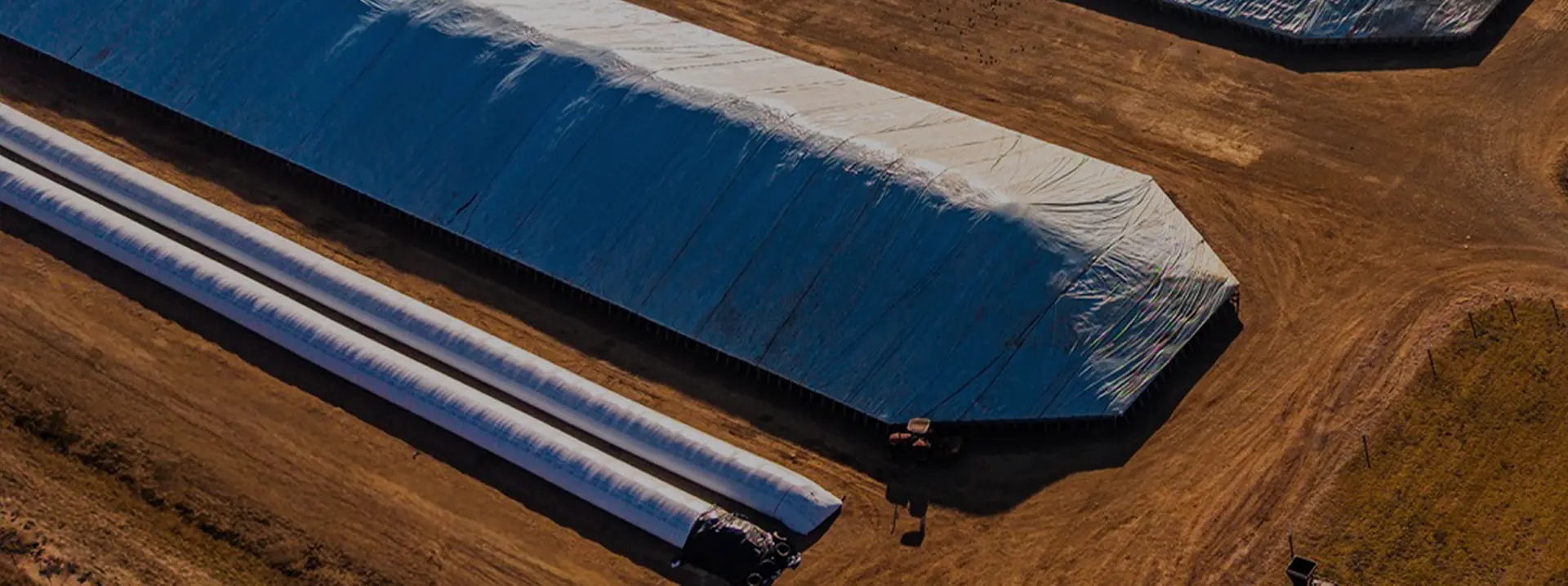 Aerial view of grain storage bunkers at a GrainCo Storage depot